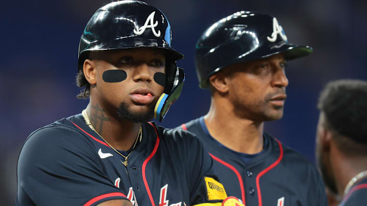 Aug 27, 2025; Miami, Florida, USA; Atlanta Braves designated hitter Ronald Acuna (13) walks toward first base after a hit by pitch against the Miami Marlins during the third inning at loanDepot Park.