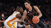 Dec 10, 2024; New York, New York, USA;  Miami Hurricanes center Lynn Kidd (1) looks to drive past Tennessee Volunteers guard Jahmai Mashack (15) in the second half at Madison Square Garden. Mandatory Credit: Wendell Cruz-Imagn Images