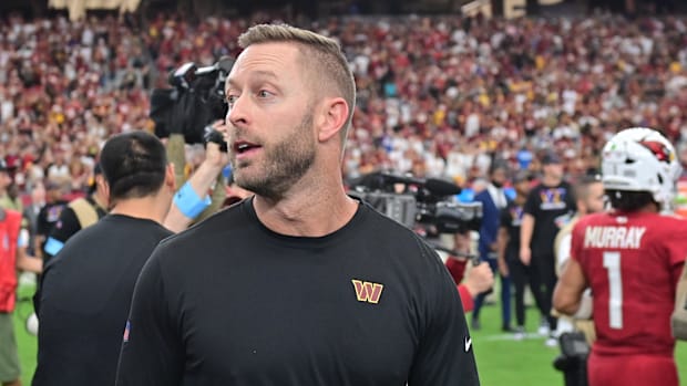 Washington Commanders offensive coordinator Kliff Kingsbury reacts after beating the Arizona Cardinals at State Farm Stadium