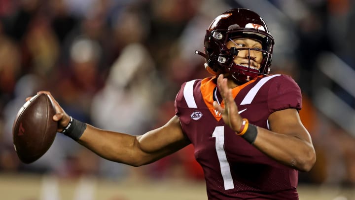 Nov 18, 2023; Blacksburg, Virginia, USA; Virginia Tech Hokies quarterback Kyron Drones (1) throws a pass against the North Carolina State Wolfpack at Lane Stadium. Mandatory Credit: Peter Casey-USA TODAY Sports