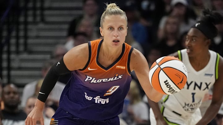 Jul 16, 2025; Minneapolis, Minnesota, USA; Phoenix Mercury guard Kitija Laksa (9) brings the ball up court against the Minnesota Lynx in the third quarter at Target Center. Mandatory Credit: Bruce Kluckhohn-Imagn Images
