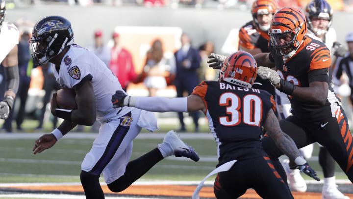 Nov 10, 2019; Cincinnati, OH, USA; Baltimore Ravens quarterback Lamar Jackson (8) runs against Cincinnati Bengals free safety Jessie Bates (30) during the second half at Paul Brown Stadium. Mandatory Credit: David Kohl-USA TODAY Sports