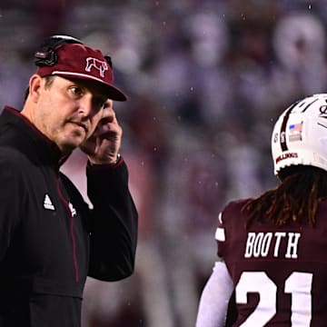 Mississippi State Bulldogs head coach Jeff Lebby speaks with players between plays against the Eastern Kentucky Colonels during the third quarter at Davis Wade Stadium at Scott Field. 