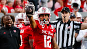 Aug 28, 2025; Raleigh, North Carolina, USA; North Carolina State Wolfpack wide receiver Teddy Hoffmann (12)  celebrates a down during the first half of the game against East Carolina Pirates at Carter-Finley Stadium. Mandatory Credit: Jaylynn Nash-Imagn Images