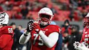 Nov 25, 2023; Raleigh, North Carolina, USA;  North Carolina State Wolfpack offensive lineman Anthony Carter Jr. (75) warms up prior to a game against the North Carolina Tar Heels at Carter-Finley Stadium. Mandatory Credit: Rob Kinnan-Imagn Images