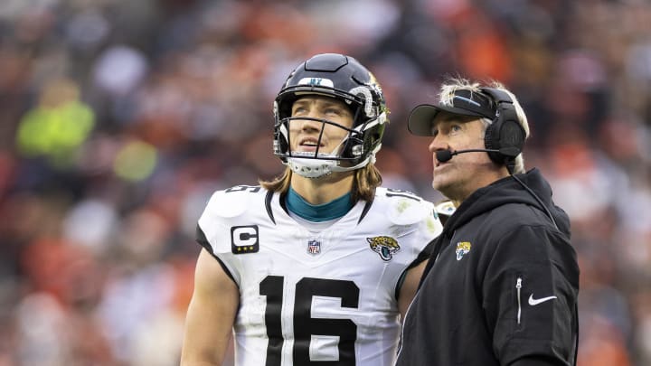 Dec 10, 2023; Cleveland, Ohio, USA; Jacksonville Jaguars head coach Doug Pederson and quarterback Trevor Lawrence (16) watched the video replay board during the third quarter against the Cleveland Browns at Cleveland Browns Stadium. 