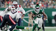 Sep 19, 2024; East Rutherford, New Jersey, USA; New York Jets running back Breece Hall (20) runs with the ball against the New England Patriots during the second quarter at MetLife Stadium.