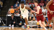 Mar 22, 2024; Memphis, TN, USA; Baylor Bears guard Ja'Kobe Walter (4) dribbles against Colgate Raiders guard Brady Cummins (1) during the first half of the NCAA Tournament First Round at FedExForum. Mandatory Credit: Petre Thomas-USA TODAY Sports