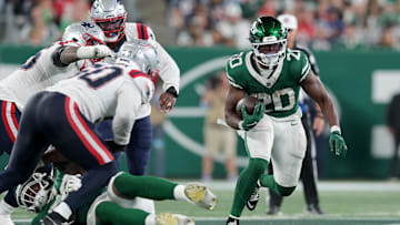 Sep 19, 2024; East Rutherford, New Jersey, USA; New York Jets running back Breece Hall (20) runs with the ball against the New England Patriots during the second quarter at MetLife Stadium. Mandatory Credit: Brad Penner-Imagn Images
