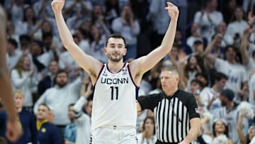 Mar 5, 2025; Storrs, Connecticut, USA; UConn Huskies forward Alex Karaban (11) reacts after his three point basket against the Marquette Golden Eagles in the second half at Harry A. Gampel Pavilion. Mandatory Credit: David Butler II-Imagn Images
