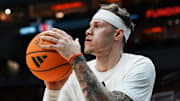 Louisville Cardinals forward Kasean Pryor (7) warms up with the team before an exhibition game at the KFC Yum! Center in Louisville, Kentucky Tuesday October 28, 2028.