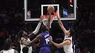 Apr 8, 2025; Charlotte, North Carolina, USA;  Charlotte Hornets center Moussa Diabate (14) drives in during the second half against the Memphis Grizzlies at the Spectrum Center. Mandatory Credit: Sam Sharpe-Imagn Images