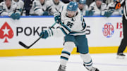 Mar 3, 2025; Toronto, Ontario, CAN; San Jose Sharks defenseman Jake Walman (96) shoots the puck against the Toronto Maple Leafs during the second period at Scotiabank Arena. Mandatory Credit: John E. Sokolowski-Imagn Images
