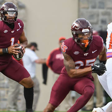 Nov 9, 2024; Virginia Tech quarterback Kyron Drones (1) looks to pass the ball against Clemson during the second quarter.