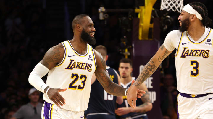 Apr 27, 2024; Los Angeles, California, USA; Los Angeles Lakers forward LeBron James (23) and center Anthony Davis (3) celebrate after a basket during the fourth quarter in game four of the first round for the 2024 NBA playoffs against the Denver Nuggets at Crypto.com Arena. Mandatory Credit: Jason Parkhurst-USA TODAY Sports