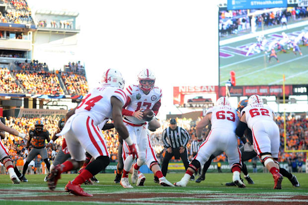 Nebraska Cornhuskers quarterback Ryker Fyfe (17) hands the ball off to running back Terrell Newby (34) during the first half.