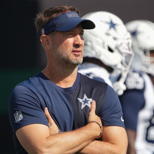 Dallas Cowboys head coach Brian Schottenheimer stands on the field during warm ups before a game against the New York Jets 
