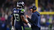 Oct 20, 2025; Seattle, Washington, USA; Seattle Seahawks linebacker Ernest Jones IV (13) talks with Seattle Seahawks head coach Mike Macdonald during the fourth quarter against the Houston Texans at Lumen Field. 