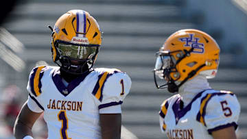 Dec 6, 2024; Birmingham, AL, USA; Jackson's Landon Duckworth (1) and Jackson's Chris Payne (5) talk during a timeout during the game with Cherokee County at Protective Stadium in the AHSAA 4A State Championship game.