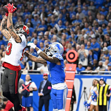 Jan 21, 2024; Detroit, Michigan, USA; Tampa Bay Buccaneers wide receiver Mike Evans (13) makes a catch against Detroit Lions cornerback Cameron Sutton (1) during the second half in a 2024 NFC divisional round game at Ford Field. Mandatory Credit: Lon Horwedel-Imagn Images