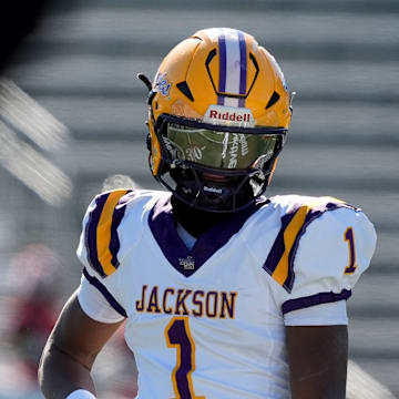 Dec 6, 2024; Birmingham, AL, USA; Jackson's Landon Duckworth (1) and Jackson's Chris Payne (5) talk during a timeout during the game with Cherokee County at Protective Stadium in the AHSAA 4A State Championship game.