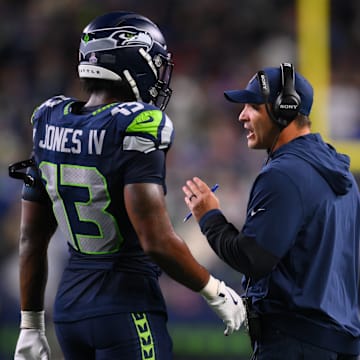 Oct 20, 2025; Seattle, Washington, USA; Seattle Seahawks linebacker Ernest Jones IV (13) talks with Seattle Seahawks head coach Mike Macdonald during the fourth quarter against the Houston Texans at Lumen Field. 