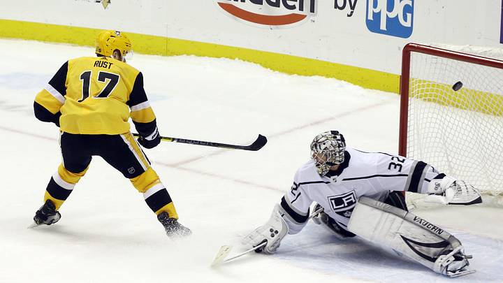 Dec 14, 2019; Pittsburgh, PA, USA;  Pittsburgh Penguins right wing Bryan Rust (17) scores the lone shootout goal past Los Angeles Kings goaltender Jonathan Quick (32) to win the game at PPG PAINTS Arena. The Penguins won 5-4 in a shootout. Mandatory Credit: Charles LeClaire-Imagn Images