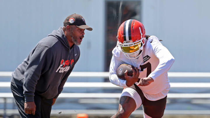 Browns running back D'Onta Foreman runs drills as running backs coach Duce Staley watches during minicamp, Wednesday, June 12, 2024, in Berea.