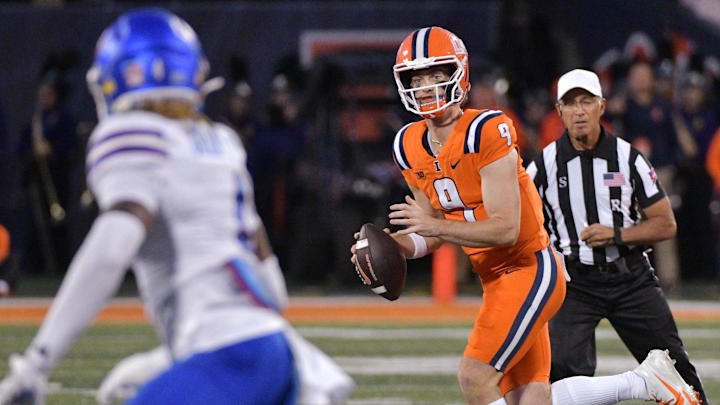 Sep 7, 2024; Champaign, Illinois, USA; Illinois Fighting Illini quarterback Luke Altmyer (9) runs with the ball during the first half against the Kansas Jayhawks at Memorial Stadium. Mandatory Credit: Ron Johnson-Imagn Images