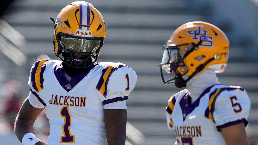Dec 6, 2024; Birmingham, AL, USA; Jackson's Landon Duckworth (1) and Jackson's Chris Payne (5) talk during a timeout during the game with Cherokee County at Protective Stadium in the AHSAA 4A State Championship game.