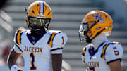 Dec 6, 2024; Birmingham, AL, USA; Jackson's Landon Duckworth (1) and Jackson's Chris Payne (5) talk during a timeout during the game with Cherokee County at Protective Stadium in the AHSAA 4A State Championship game.