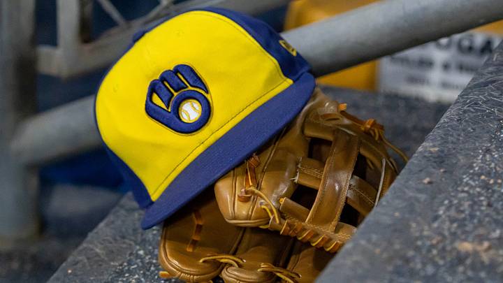 Apr 21, 2026; Detroit, Michigan, USA; A Milwaukee Brewers hat and glove in the dugout during the seventh inning against the Detroit Tigers at Comerica Park. Mandatory Credit: David Reginek-Imagn Images