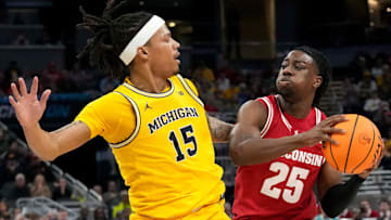 Michigan Wolverines guard Rubin Jones (15) guards Wisconsin Badgers guard John Blackwell (25) during the first half of the 2025 TIAA Big Ten Men’s Basketball Tournament final game on Sunday, March 16, 2025, at Gainbridge Fieldhouse in Indianapolis. Michigan defeated Wisconsin 59-53.