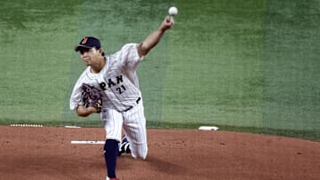 Mar 21, 2023; Miami, Florida, USA; Japan starting pitcher Shota Imanaga (21) pitches against the USA