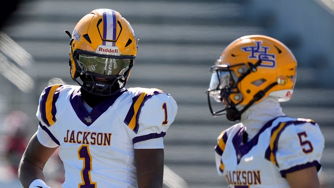 Dec 6, 2024; Birmingham, AL, USA; Jackson's Landon Duckworth (1) and Jackson's Chris Payne (5) talk during a timeout during the game with Cherokee County at Protective Stadium in the AHSAA 4A State Championship game.