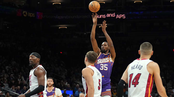 Nov 6, 2024; Phoenix, Arizona, USA; Phoenix Suns forward Kevin Durant (35) shoots against the Miami Heat during the first half at Footprint Center. Mandatory Credit: Joe Camporeale-Imagn Images