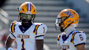 Dec 6, 2024; Birmingham, AL, USA; Jackson's Landon Duckworth (1) and Jackson's Chris Payne (5) talk during a timeout during the game with Cherokee County at Protective Stadium in the AHSAA 4A State Championship game.