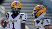 Dec 6, 2024; Birmingham, AL, USA; Jackson's Landon Duckworth (1) and Jackson's Chris Payne (5) talk during a timeout during the game with Cherokee County at Protective Stadium in the AHSAA 4A State Championship game.