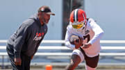 Browns running back D'Onta Foreman runs drills as running backs coach Duce Staley watches during minicamp, Wednesday, June 12, 2024, in Berea.