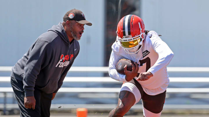 Browns running back D'Onta Foreman runs drills as running backs coach Duce Staley watches during minicamp, Wednesday, June 12, 2024, in Berea.