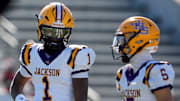 Dec 6, 2024; Birmingham, AL, USA; Jackson's Landon Duckworth (1) and Jackson's Chris Payne (5) talk during a timeout during the game with Cherokee County at Protective Stadium in the AHSAA 4A State Championship game.