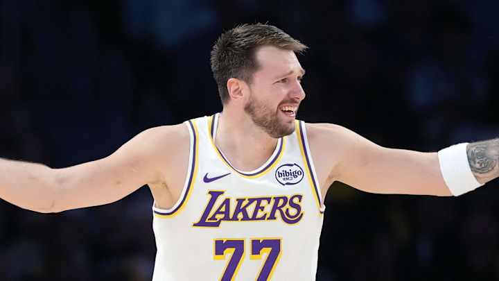 Mar 8, 2026; Los Angeles, California, USA; Los Angeles Lakers guard Luka Doncic (77) and New York Knicks center Karl-Anthony Towns (32) react in the second half at Crypto.com Arena. Mandatory Credit: Kirby Lee-Imagn Images