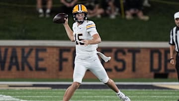 Nov 8, 2024; Winston-Salem, North Carolina, USA; California Golden Bears quarterback Fernando Mendoza (15) throws against the Wake Forest Demon Deacons during the first half at Allegacy Federal Credit Union Stadium. Mandatory Credit: Jim Dedmon-Imagn Images