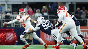 Nov 27, 2025; Arlington, Texas, USA; Kansas City Chiefs quarterback Patrick Mahomes (15) runs with the ball against Dallas Cowboys defensive tackle Quinnen Williams (92) during the second quarter at AT&T Stadium. Mandatory Credit: Kevin Jairaj-Imagn Images