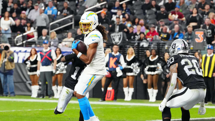 Dec 14, 2023; Paradise, Nevada, USA; Los Angeles Chargers wide receiver Quentin Johnston (1) makes a catch for a touchdown against Las Vegas Raiders cornerback Jack Jones (18) in the fourth quarter at Allegiant Stadium. Mandatory Credit: Stephen R. Sylvanie-USA TODAY Sports