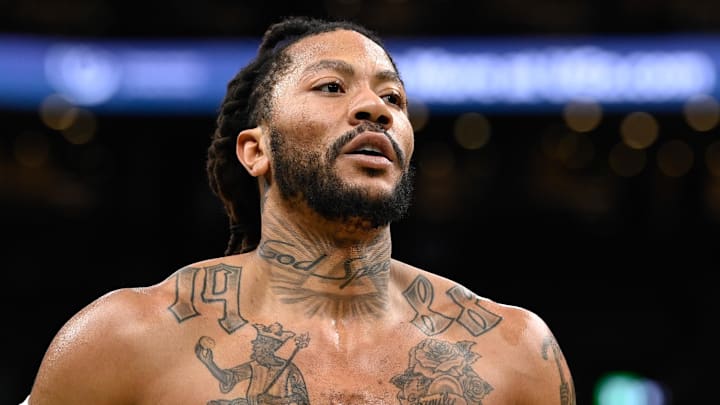 =Memphis Grizzlies guard Derrick Rose (23) warms up before a game against the Boston Celtics at TD Garden. Mandatory Credit: Eric Canha-Imagn Images