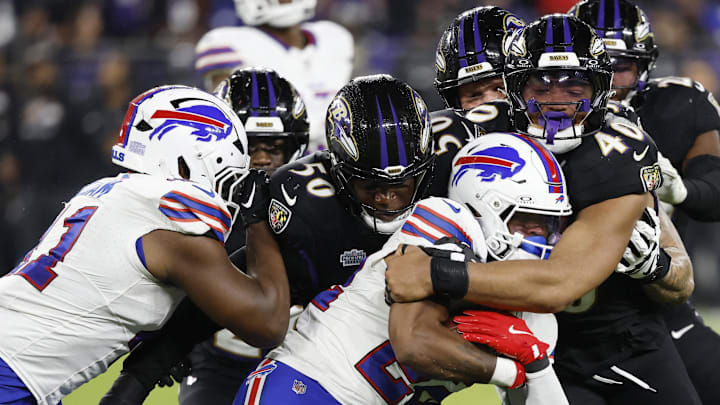Sep 29, 2024; Baltimore, Maryland, USA; Buffalo Bills running back Ray Davis (22) is tackled by Baltimore Ravens linebacker Adisa Isaac (50) and Ravens linebacker Malik Harrison (40) at M&T Bank Stadium. Mandatory Credit: Geoff Burke-Imagn Images Sep 29, 2024; Baltimore, Maryland, USA; Buffalo Bills running back Ray Davis (22) is tackled by Baltimore Ravens linebacker Adisa Isaac (50) and Ravens linebacker Malik Harrison (40) at M&T Bank Stadium. Mandatory Credit: Geoff Burke-Imagn Images