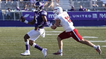 Aug 31, 2024; Evanston, Illinois, USA; Miami (Oh) Redhawks linebacker Corban Hondru (12) chases Northwestern Wildcats quarterback Mike Wright (5) during the second half at Lanny and Sharon Martin Stadium. Mandatory Credit: David Banks-USA TODAY Sports