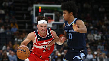 Nov 8, 2024; Memphis, Tennessee, USA; Washington Wizards forward Corey Kispert (24) drives against Memphis Grizzlies forward Jaylen Wells (0) during the first half at FedExForum. Mandatory Credit: Petre Thomas-Imagn Images