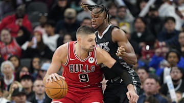Dec 5, 2024; San Antonio, Texas, USA; Chicago Bulls center Nikola Vucevic (9) drives to the basket while defended by San Antonio Spurs center Charles Bassey (28) during the second half at Frost Bank Center. Mandatory Credit: Scott Wachter-Imagn Images